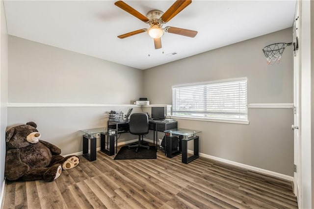 2808 E Cedar Pl, Tonganoxie, KS 66086 - home office with wood finished floors, a ceiling fan, and baseboards
