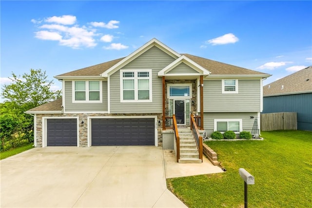 2808 E Cedar Pl, Tonganoxie, KS 66086 - split foyer home featuring concrete driveway, an attached garage, and a shingled roof