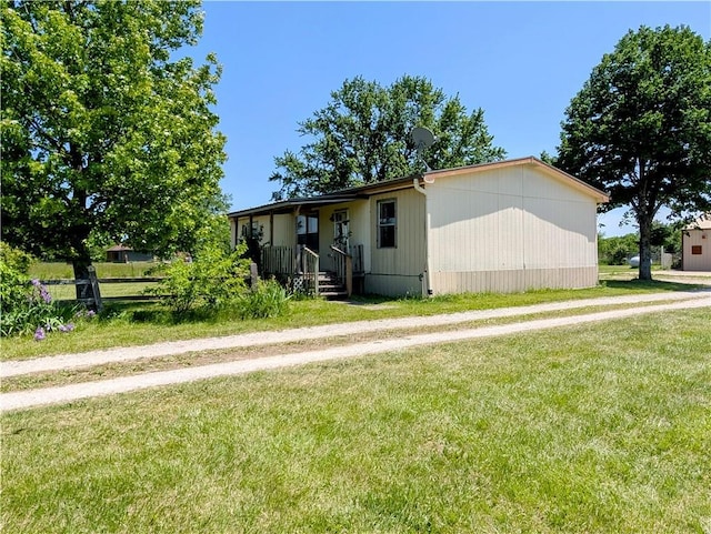 view of front of property with a front lawn
