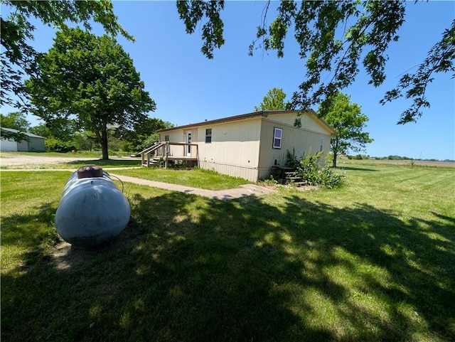 view of property exterior with a yard