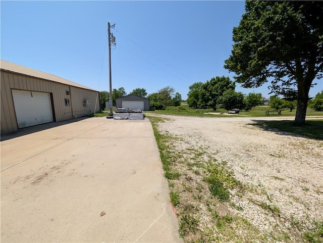 view of front of property with an outbuilding and a detached garage