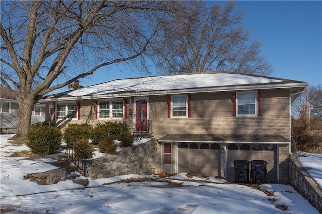 15402 E 37th Ter, Independence, MO 64055 - view of front facade featuring an attached garage, a chimney, and brick siding