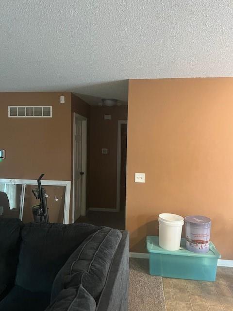 2216 Chanticleer St, Excelsior Springs, MO 64024 - bedroom featuring baseboards and a textured ceiling
