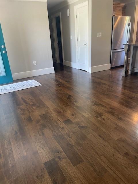21162 147th St, Basehor, KS 66007 - unfurnished room with dark wood-style flooring and baseboards