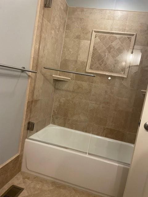 21162 147th St, Basehor, KS 66007 - bathroom featuring shower / bath combination with glass door and tile patterned flooring