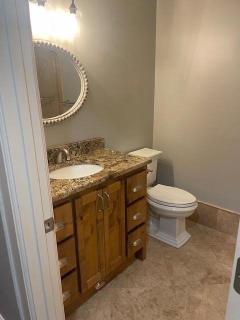 21162 147th St, Basehor, KS 66007 - bathroom with vanity, toilet, and tile patterned flooring