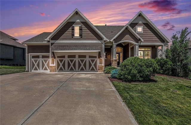 25072 W 114th Ct, Olathe, KS 66061 - craftsman-style house featuring a yard, concrete driveway, an attached garage, and stone siding