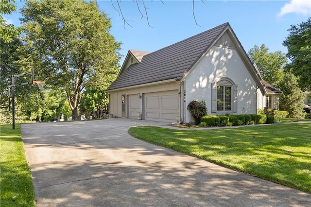 3644 W 127th Ter, Leawood, KS 66209 - view of front of property with concrete driveway, a garage, a front yard, and stucco siding