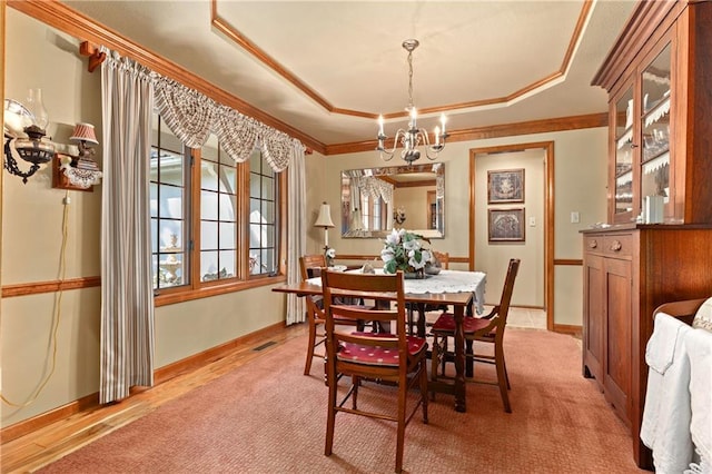 3644 W 127th Ter, Leawood, KS 66209 - dining room featuring a chandelier, ornamental molding, a tray ceiling, light colored carpet, and baseboards