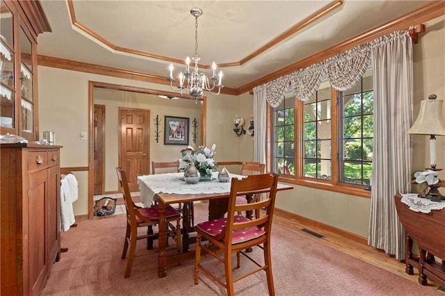 3644 W 127th Ter, Leawood, KS 66209 - dining room with ornamental molding, a chandelier, a raised ceiling, and baseboards
