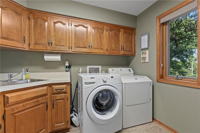3644 W 127th Ter, Leawood, KS 66209 - washroom with cabinet space, washing machine and dryer, baseboards, and light tile patterned floors