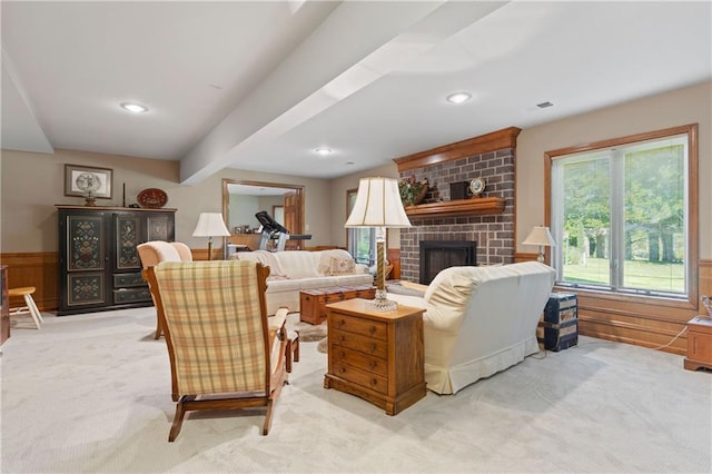 3644 W 127th Ter, Leawood, KS 66209 - living room featuring light colored carpet, a fireplace, wainscoting, recessed lighting, and beamed ceiling