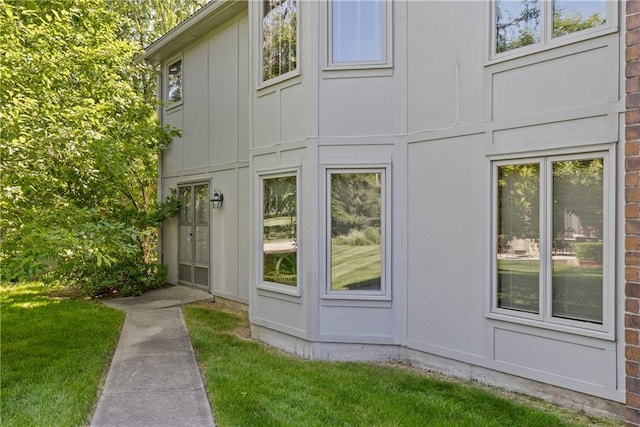3644 W 127th Ter, Leawood, KS 66209 - view of side of home featuring board and batten siding and a lawn