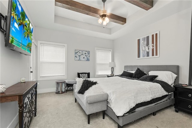 807 NE Algonquin St Unit B, Lees Summit, MO 64064 - bedroom with carpet flooring, multiple windows, baseboards, ceiling fan, and beamed ceiling