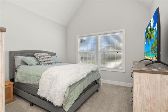 807 NE Algonquin St Unit B, Lees Summit, MO 64064 - bedroom with light carpet, baseboards, and high vaulted ceiling