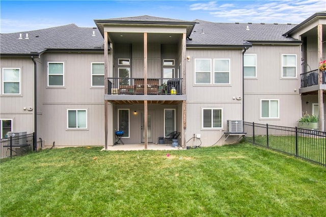 807 NE Algonquin St Unit B, Lees Summit, MO 64064 - rear view of house featuring a patio, a balcony, and a shingled roof