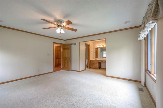 25908 Colbern Rd, Lees Summit, MO 64086 - unfurnished bedroom with light colored carpet, baseboards, ornamental molding, and connected bathroom