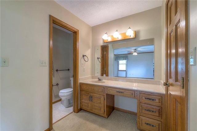 25908 Colbern Rd, Lees Summit, MO 64086 - bathroom featuring vanity, toilet, a ceiling fan, and baseboards