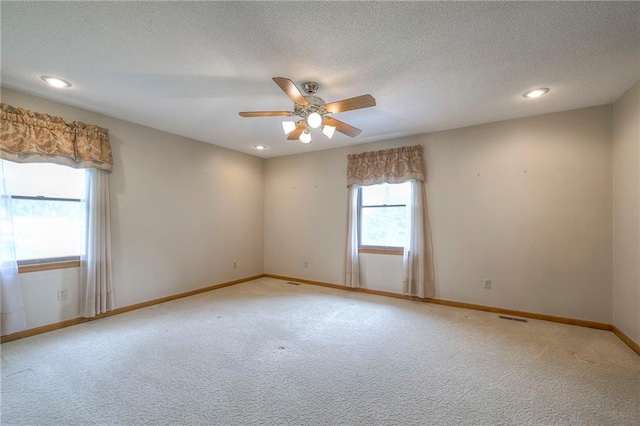 25908 Colbern Rd, Lees Summit, MO 64086 - carpeted empty room with a ceiling fan, baseboards, a textured ceiling, and recessed lighting