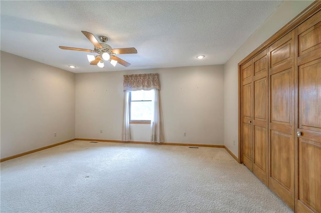 25908 Colbern Rd, Lees Summit, MO 64086 - unfurnished bedroom with light colored carpet, baseboards, a textured ceiling, and a closet