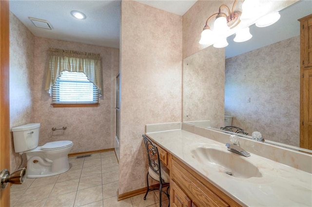 25908 Colbern Rd, Lees Summit, MO 64086 - bathroom with toilet, vanity, a chandelier, tile patterned floors, and wallpapered walls