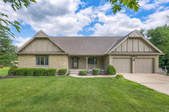 25908 Colbern Rd, Lees Summit, MO 64086 - view of front of property featuring an attached garage, board and batten siding, stone siding, and concrete driveway