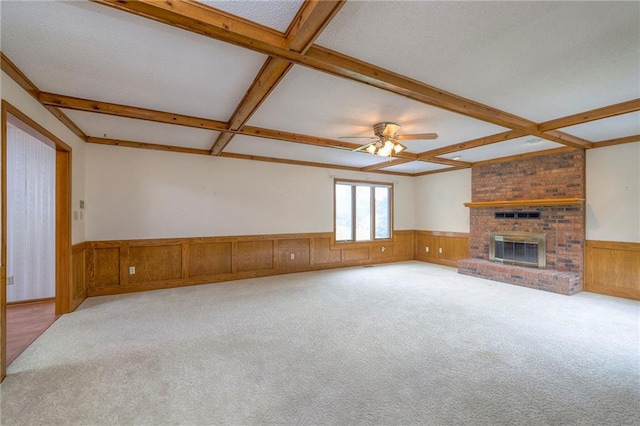 25908 Colbern Rd, Lees Summit, MO 64086 - unfurnished living room featuring wainscoting, beamed ceiling, coffered ceiling, carpet, and a ceiling fan