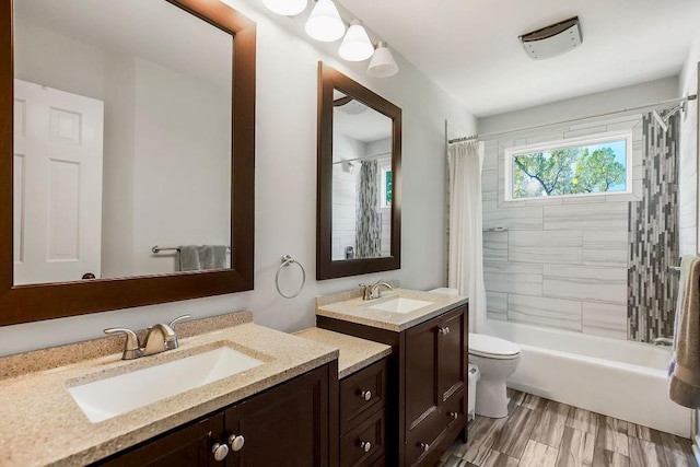 8911 W 104th St, Overland Park, KS 66212 - full bathroom with two vanities, toilet, and shower / bath combo with shower curtain