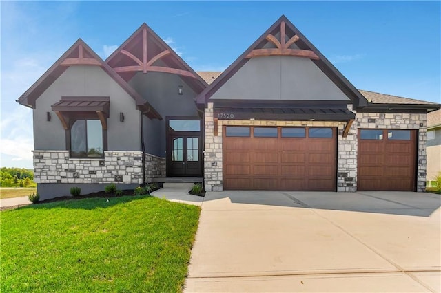 17556 Acton St, Overland Park, KS 66085 - view of front of property with stone siding, a front yard, stucco siding, driveway, and french doors