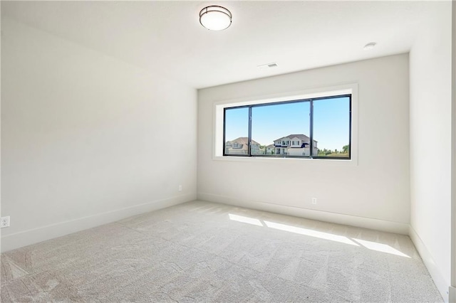 17556 Acton St, Overland Park, KS 66085 - carpeted spare room featuring baseboards