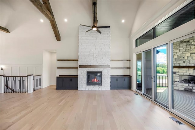 17556 Acton St, Overland Park, KS 66085 - unfurnished living room with a fireplace, ceiling fan, high vaulted ceiling, beamed ceiling, and wood finished floors