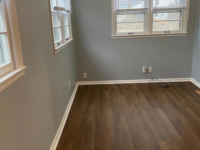5333 Outlook St, Mission, KS 66202 - spare room with dark wood-style floors and baseboards