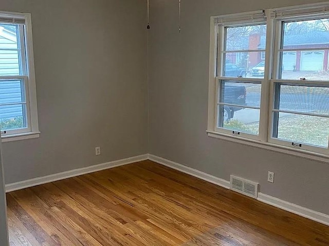 5333 Outlook St, Mission, KS 66202 - spare room with wood finished floors and baseboards