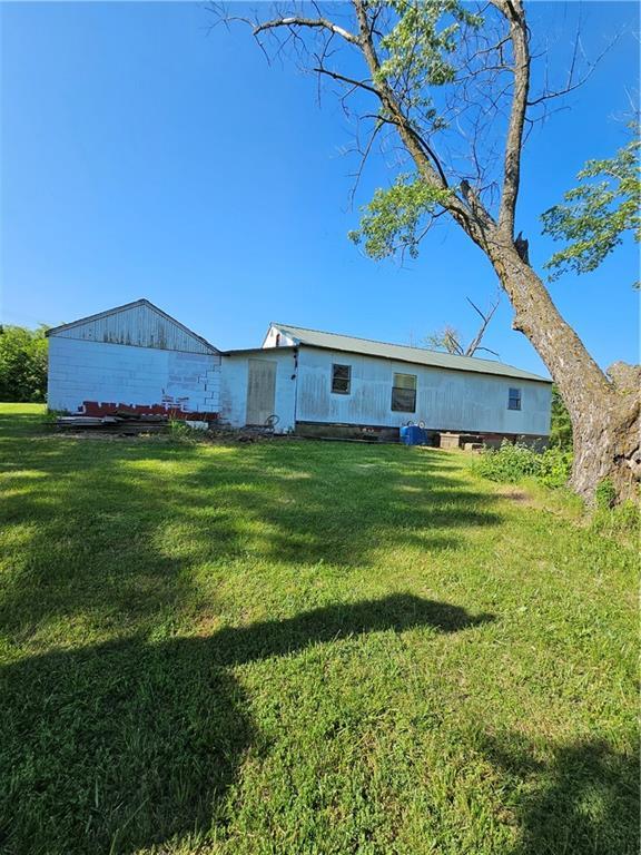 W 83rd St Unit 30720, De Soto, KS 66018 - back of house featuring a yard