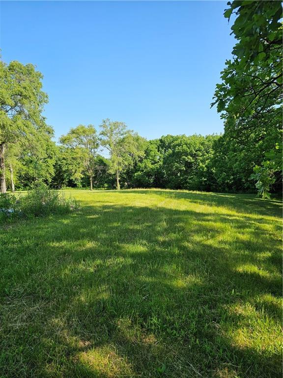 W 83rd St Unit 30720, De Soto, KS 66018 - view of grassy yard featuring a forest view
