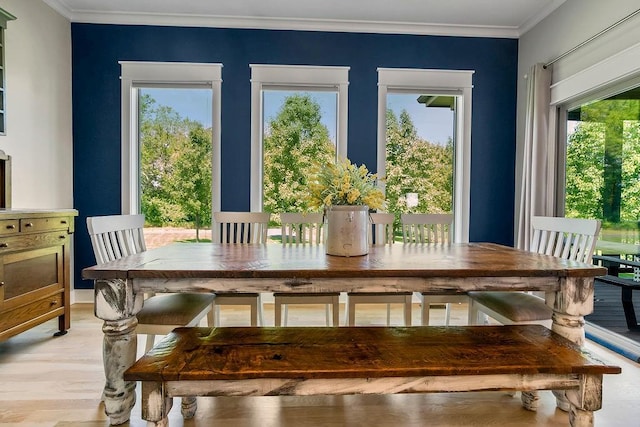 9305 SW Sushi Cir, Lees Summit, MO 64064 - dining room with light wood finished floors and ornamental molding