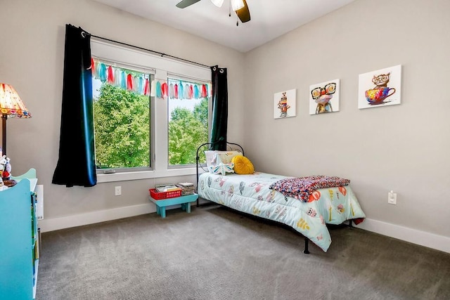9305 SW Sushi Cir, Lees Summit, MO 64064 - carpeted bedroom featuring baseboards and a ceiling fan