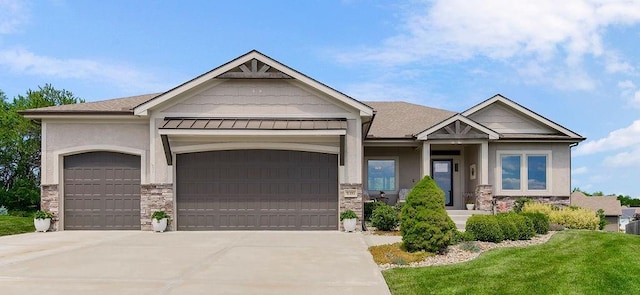 9305 SW Sushi Cir, Lees Summit, MO 64064 - craftsman-style house with stone siding, an attached garage, concrete driveway, and stucco siding