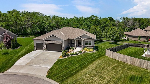 9305 SW Sushi Cir, Lees Summit, MO 64064 - view of front facade featuring concrete driveway, an attached garage, and stone siding