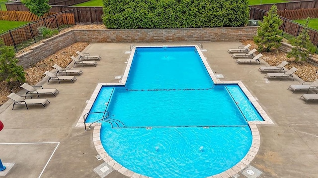 9305 SW Sushi Cir, Lees Summit, MO 64064 - community pool with a fenced backyard and a patio