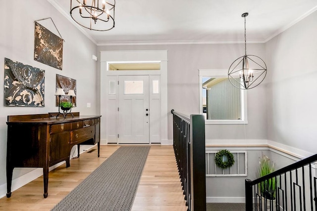 9305 SW Sushi Cir, Lees Summit, MO 64064 - entryway with a chandelier, light wood finished floors, and ornamental molding