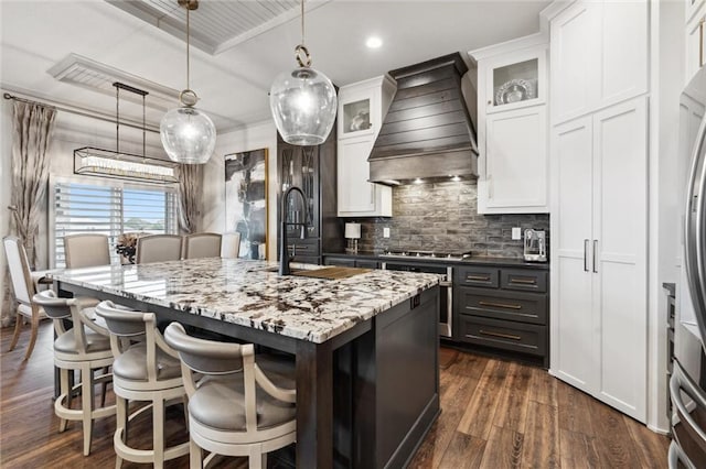 15278 W 173rd St, Olathe, KS 66062 - kitchen with custom range hood, a sink, white cabinets, dark wood-style floors, and backsplash
