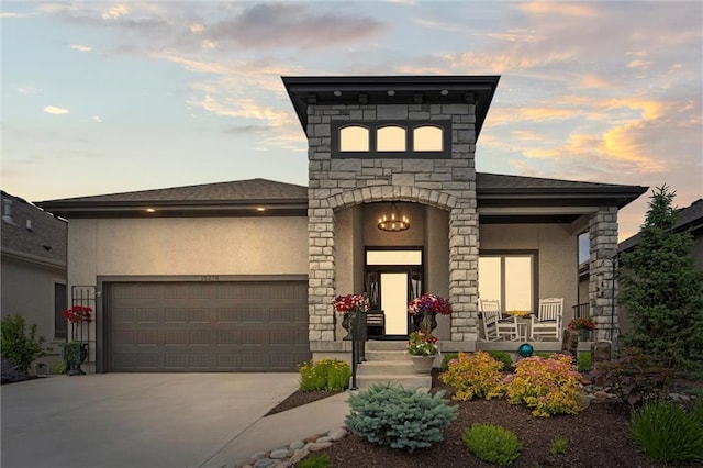 15278 W 173rd St, Olathe, KS 66062 - view of front of home featuring a garage, stone siding, driveway, stucco siding, and covered porch