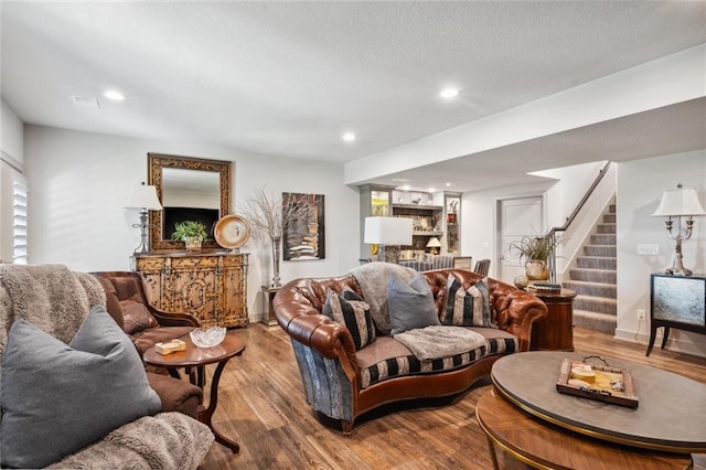15278 W 173rd St, Olathe, KS 66062 - living area featuring stairs, wood finished floors, baseboards, and recessed lighting