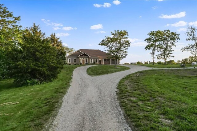 9425 NE 188th St, Trimble, MO 64492 - single story home featuring a garage, a front yard, and driveway
