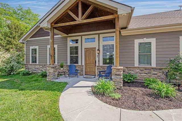 9425 NE 188th St, Trimble, MO 64492 - property entrance with stone siding, a lawn, covered porch, and a shingled roof