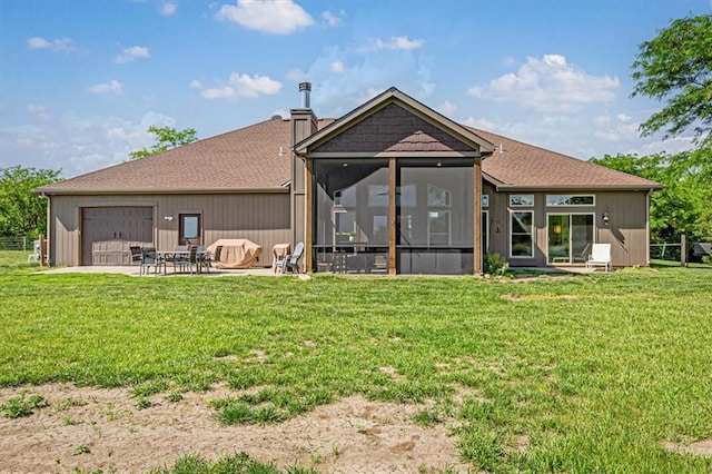 9425 NE 188th St, Trimble, MO 64492 - back of property with a sunroom, a chimney, a yard, an attached garage, and a patio