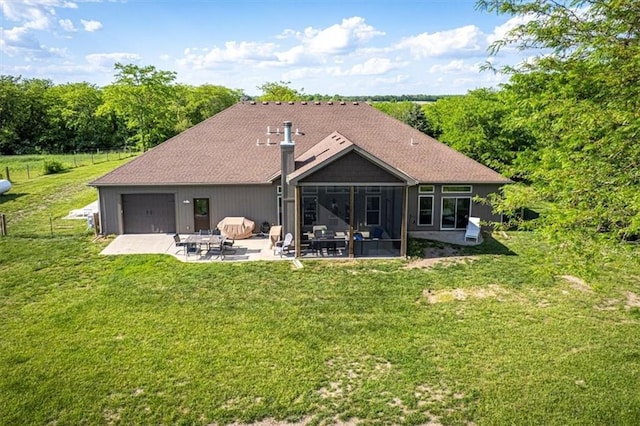 9425 NE 188th St, Trimble, MO 64492 - back of house featuring a sunroom, a patio, and a lawn