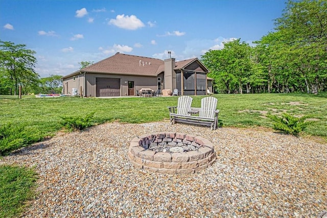 9425 NE 188th St, Trimble, MO 64492 - back of house featuring an outdoor fire pit and a yard