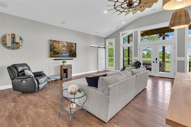 9425 NE 188th St, Trimble, MO 64492 - living area featuring wood-type flooring, french doors, a barn door, high vaulted ceiling, and ceiling fan